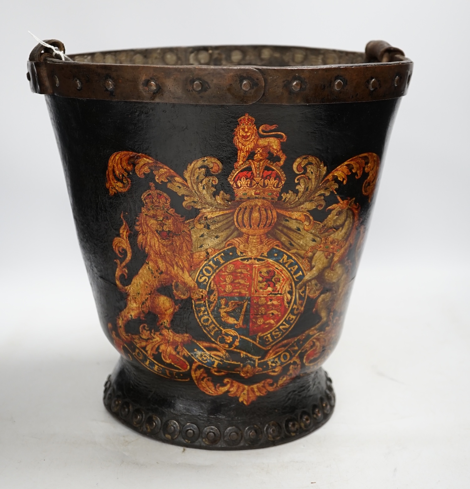 A 19th century painted fire bucket with swing handle, 29cm. Condition - fair
